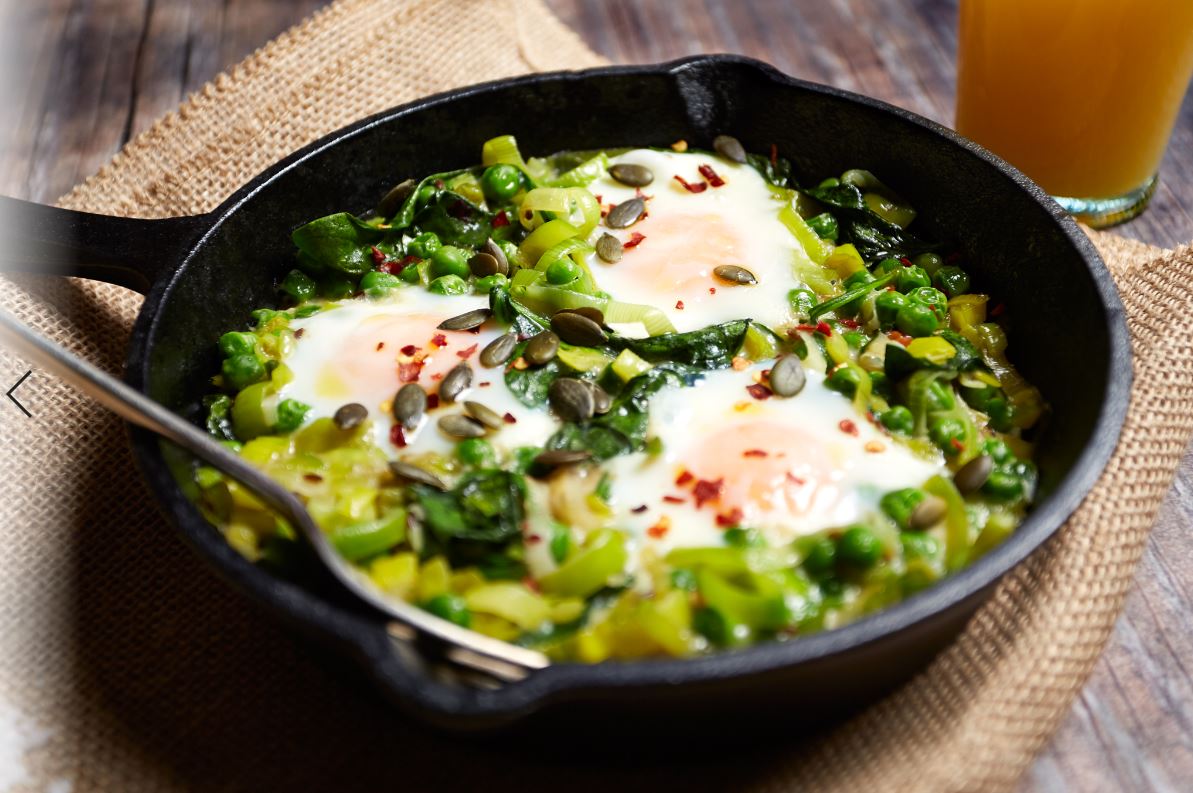 Green Baked Eggs with Peas, Leeks and Feta Seed Crumble
